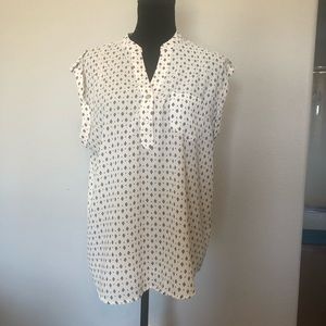 White blouse with blue flowerish design